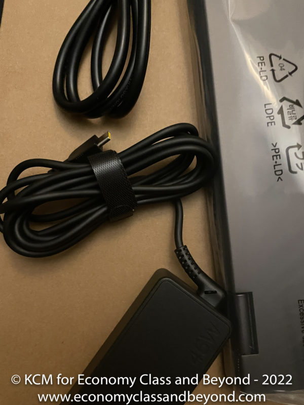 a black cord next to a black box