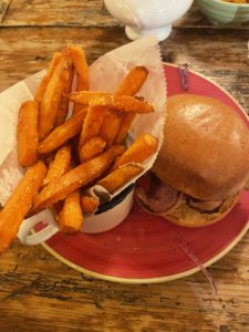 a burger and fries on a plate