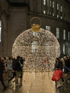 a large ball shaped light display in a building