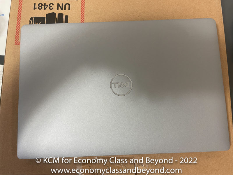 a silver laptop on a cardboard box