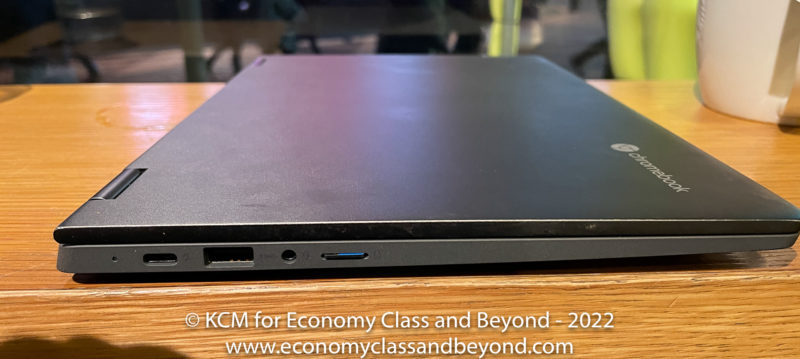 a black laptop on a wood surface
