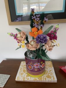 a flower arrangement in a can