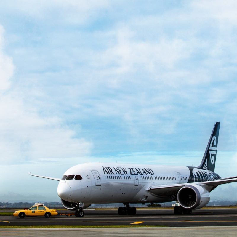 a white airplane on a runway