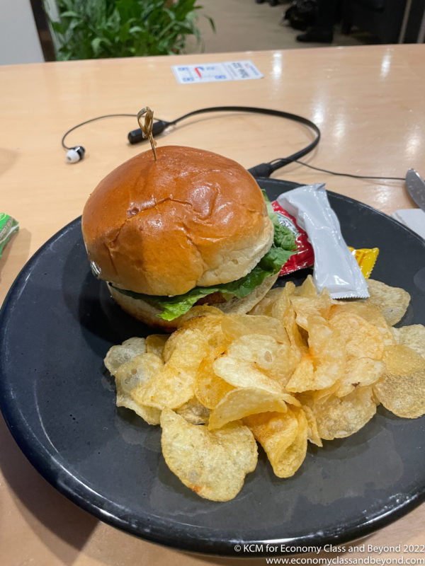 a burger and chips on a plate