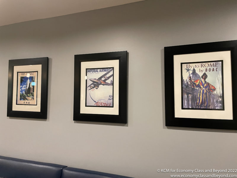 a group of framed pictures on a wall