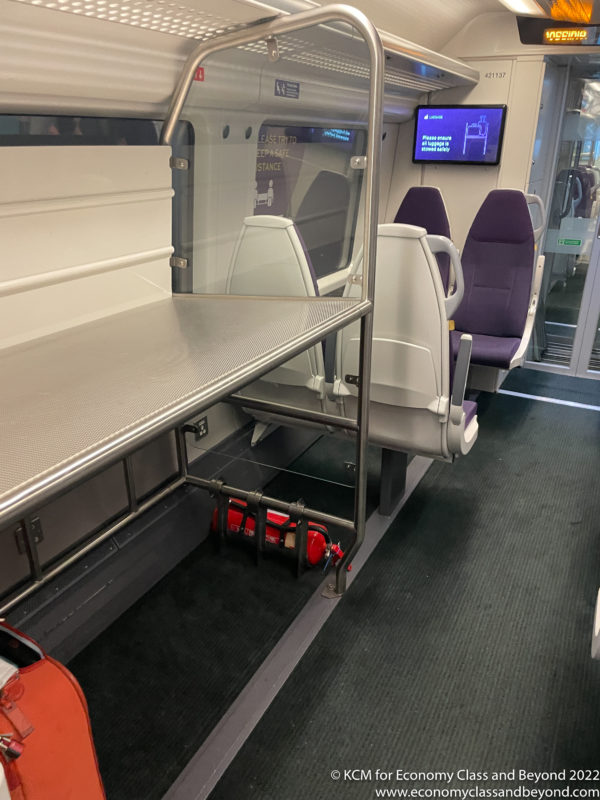 a train with seats and a table