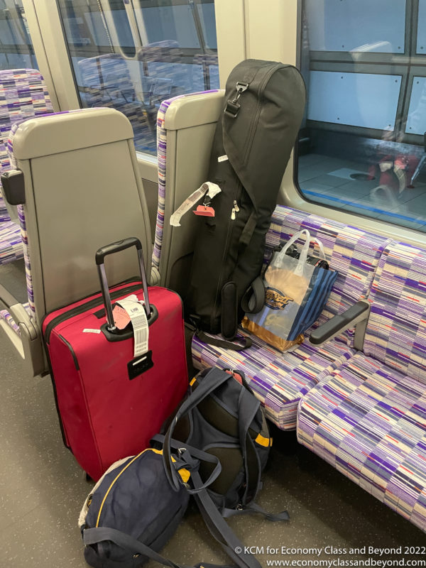 a group of luggage on a train