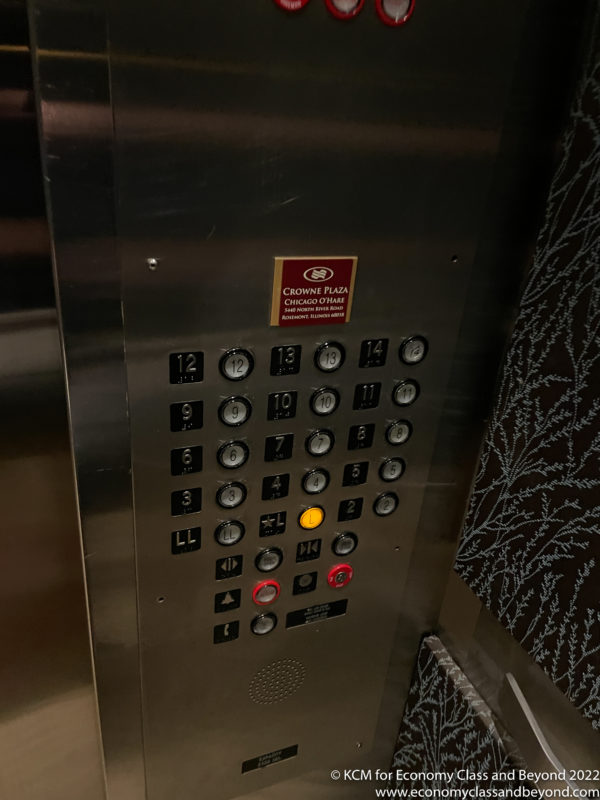 a elevator panel with buttons and lights