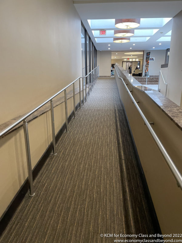 a walkway with a handrail