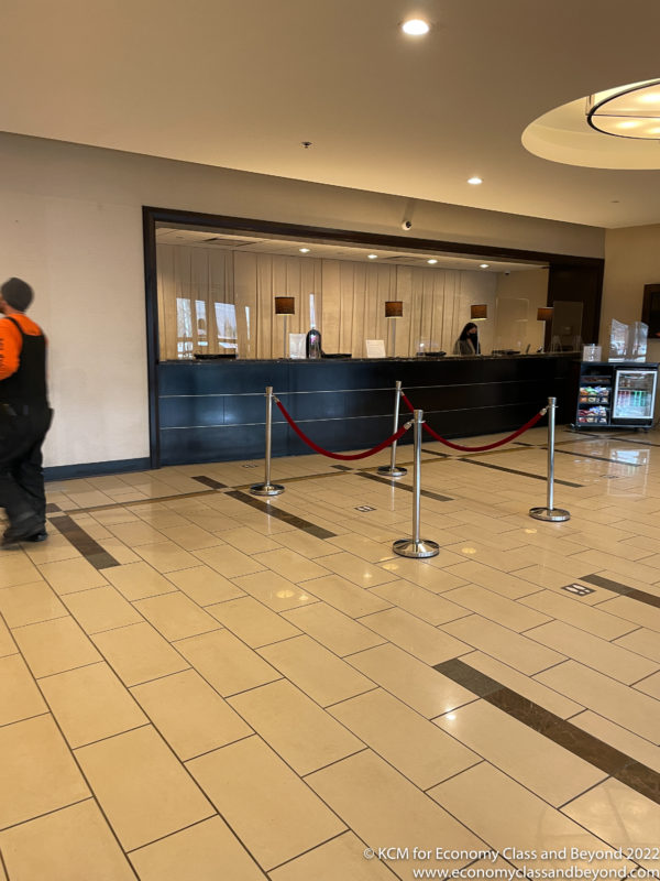 a man walking in front of a reception desk