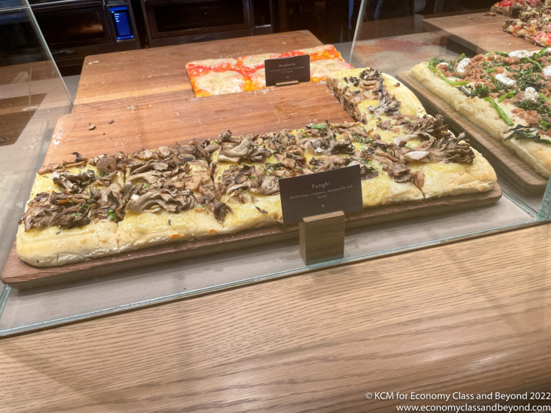 a rectangular pizza with mushrooms on it