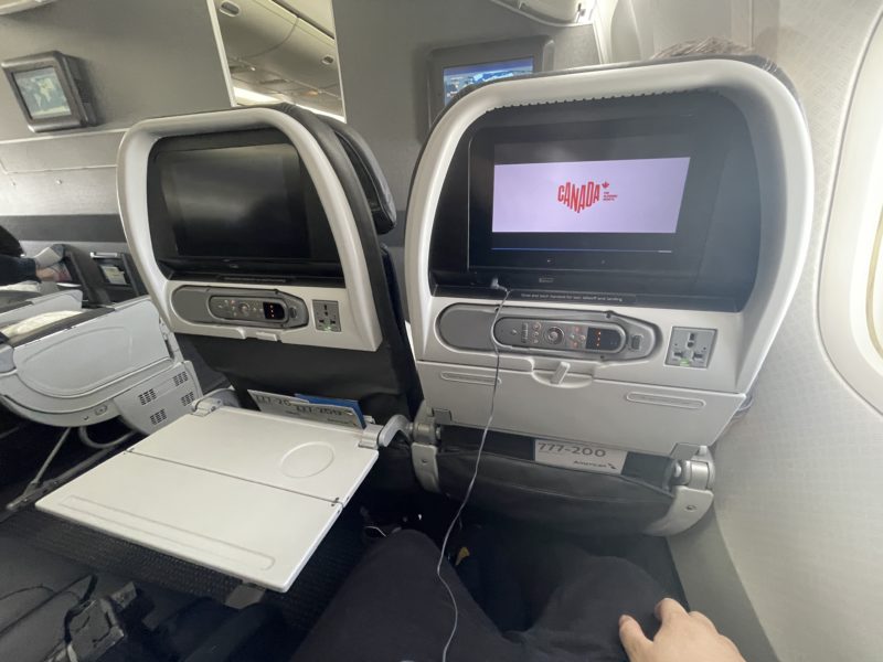 a pair of seats with two monitors