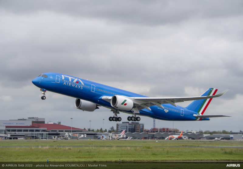 a blue airplane taking off