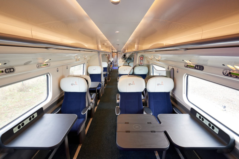 a train with seats and tables