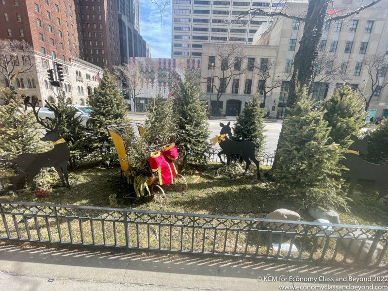 a christmas tree and decorations in a city