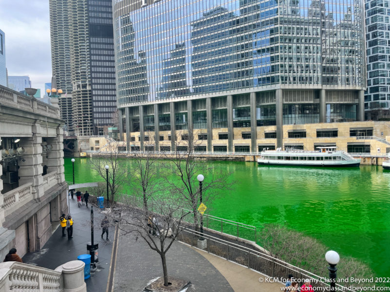 a river with green water in the middle of a city