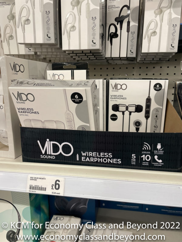 a shelf with boxes of earphones