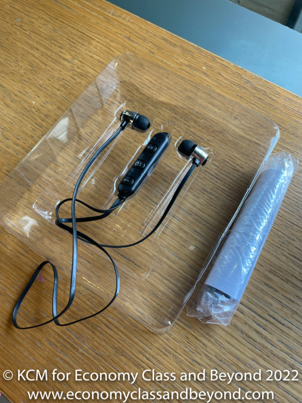 a pair of earphones in a plastic package