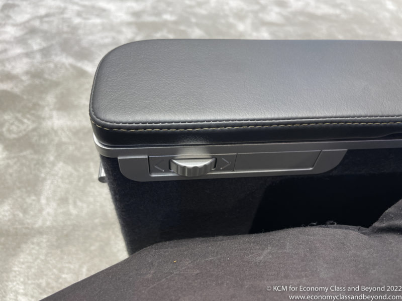 a arm rest with a button on the side