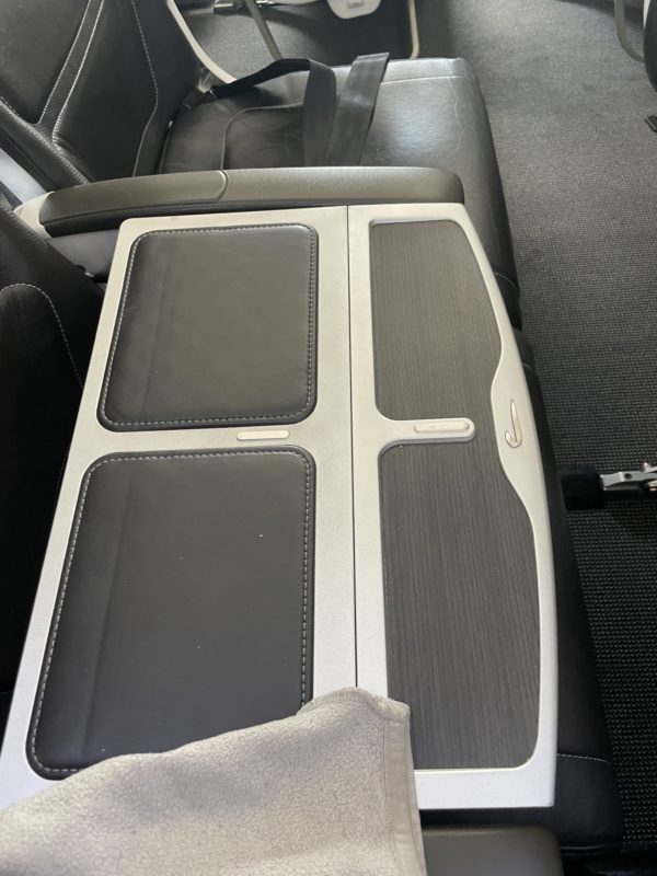 a black and white rectangular object on a black seat