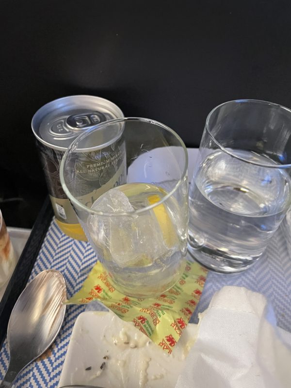 a group of glasses and a can of water
