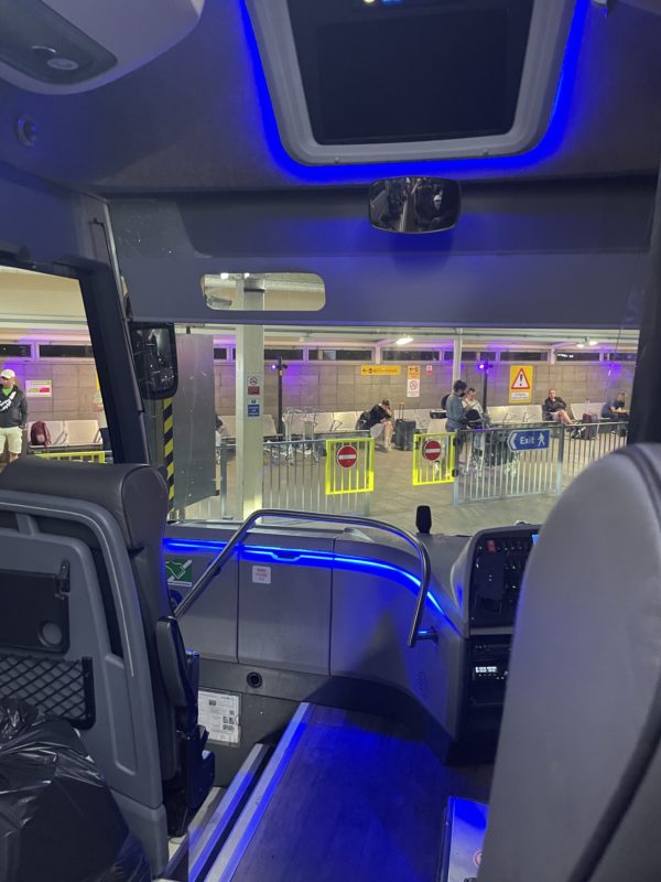 inside a bus with blue lights