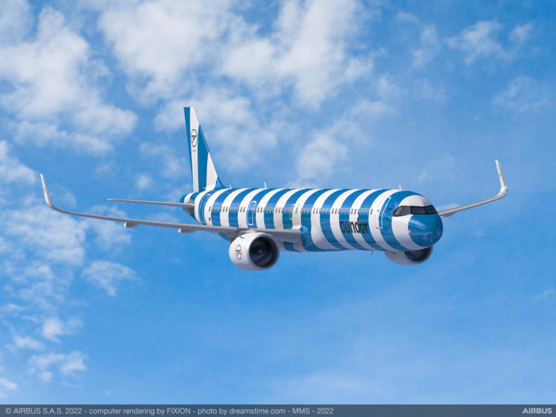 a blue and white airplane in the sky
