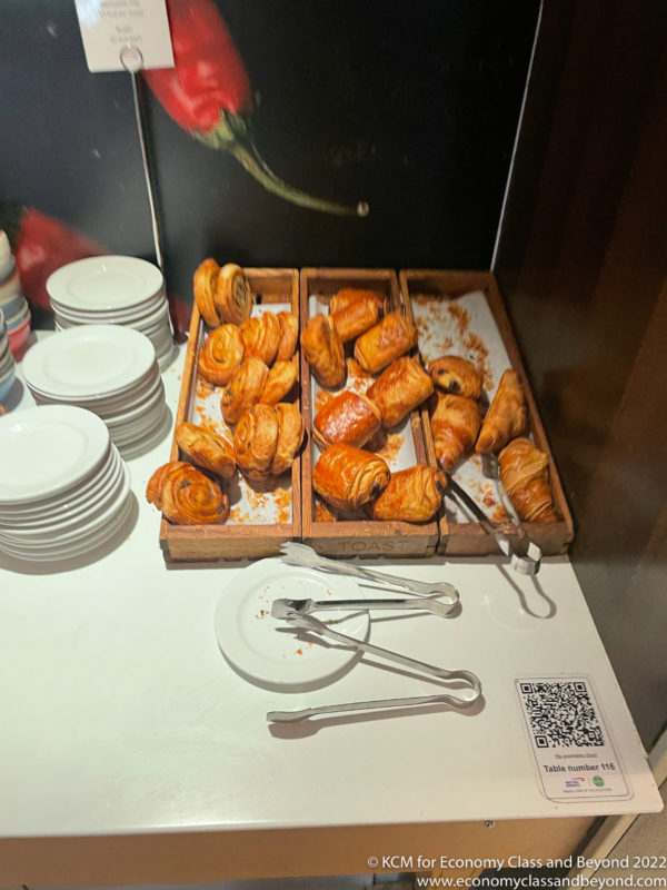 a tray of pastries and plates