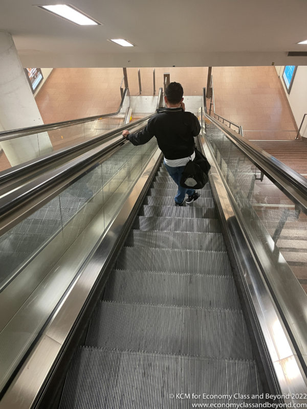a man on an escalator