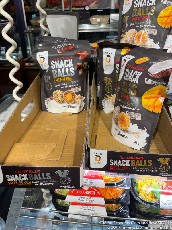 a group of bags of snacks on a shelf