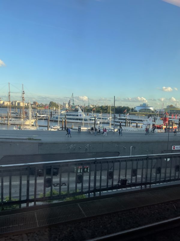 a view of a harbor from a train window