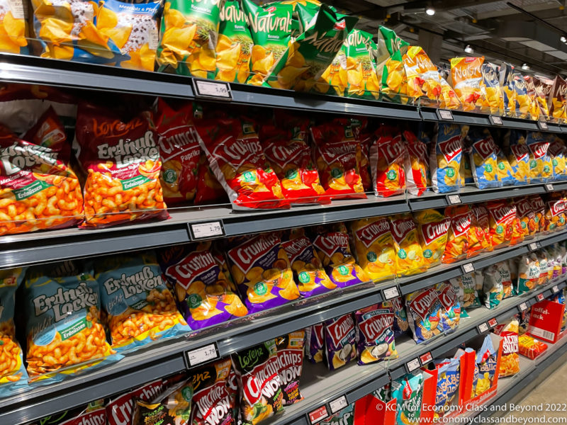 a shelves with bags of chips