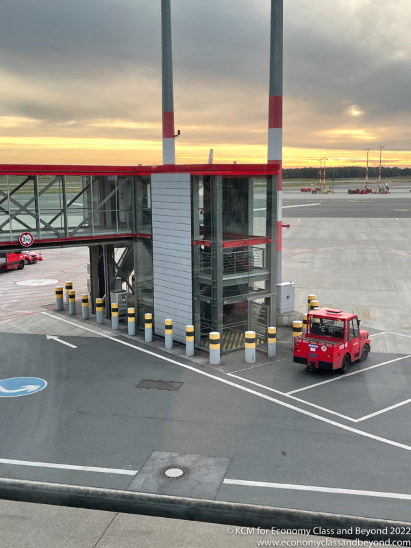 a red truck parked at an airport