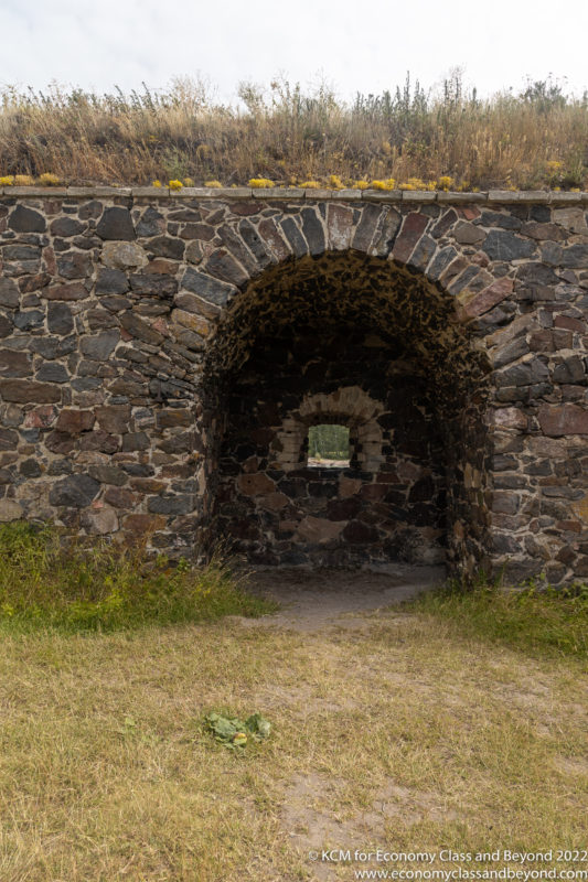 a stone wall with a hole in the wall