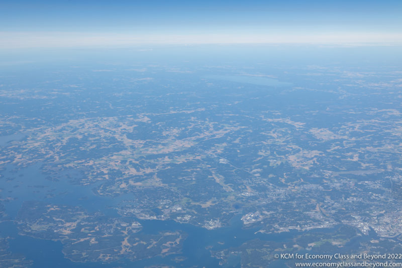 an aerial view of land and water