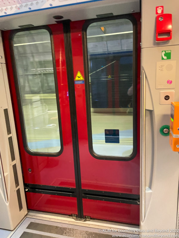a red double doors with glass windows