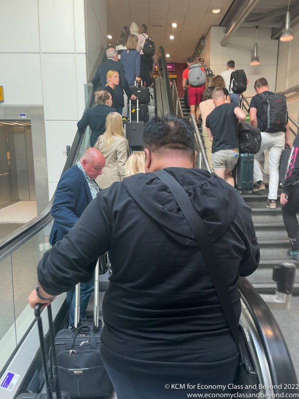 a group of people on an escalator