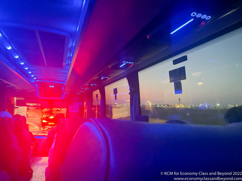 inside a bus with lights and seats