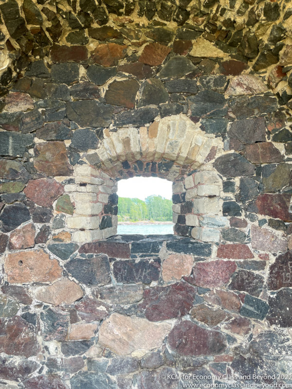 a stone wall with a window