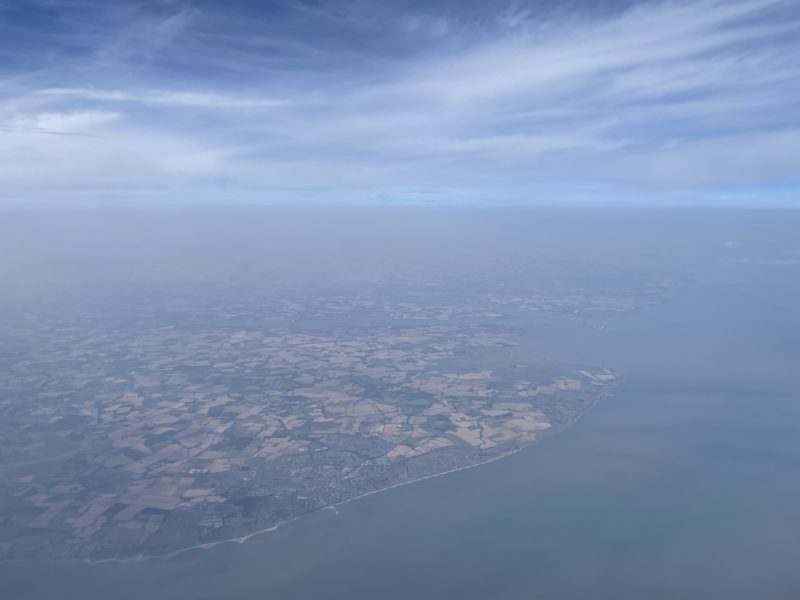an aerial view of land and water