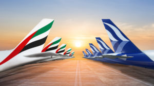 a row of airplanes on a runway