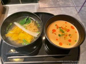 two bowls of soup and noodles