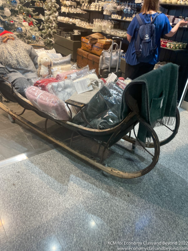 a person in a sleigh with a stuffed animal