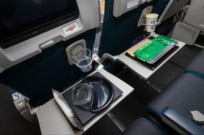 a trays and plates on a table in an airplane