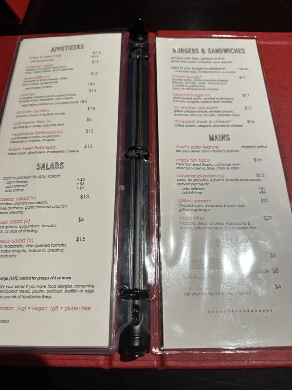 a menu with a black handle