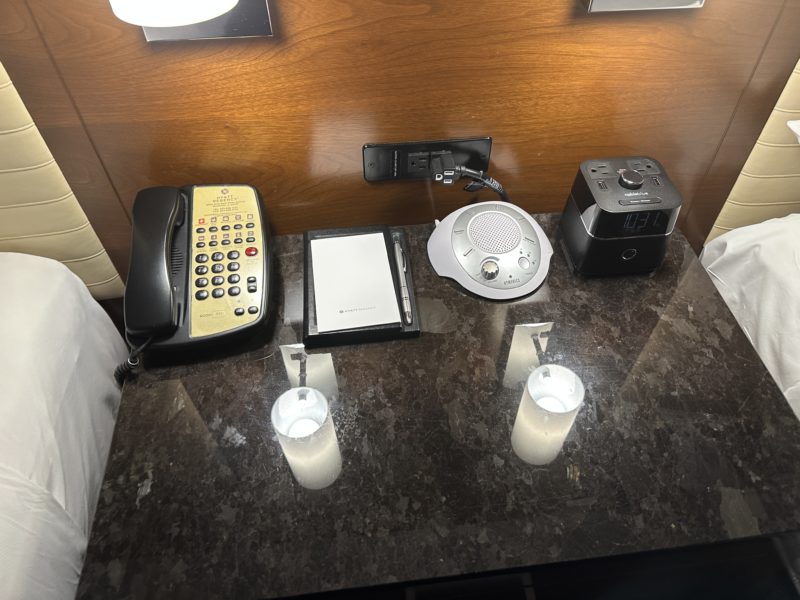 a desk with a phone and a telephone on it