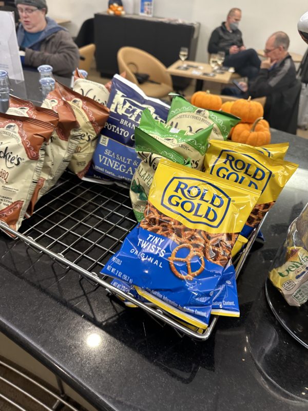 a group of bags of snacks on a rack
