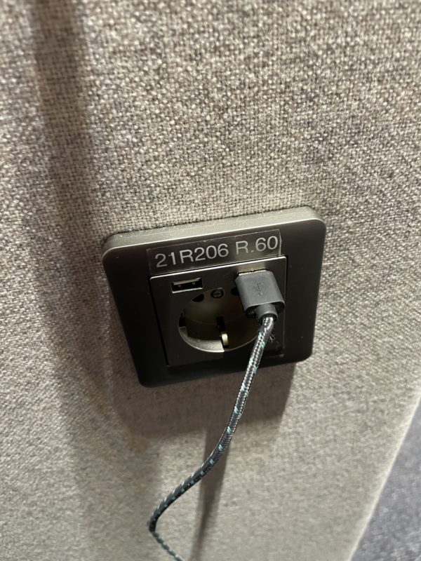 a black electrical outlet with a cord
