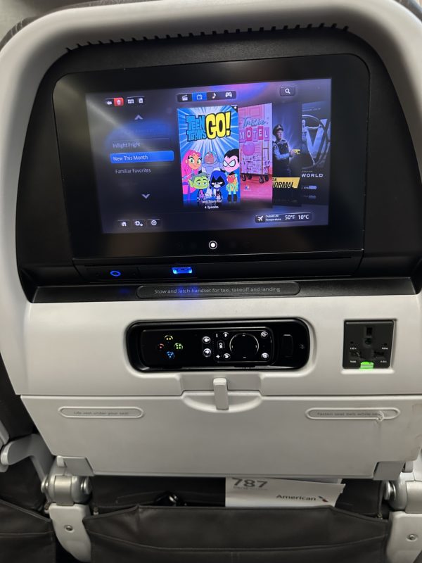 a screen on the seat of an airplane
