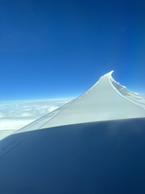 an airplane wing in the sky